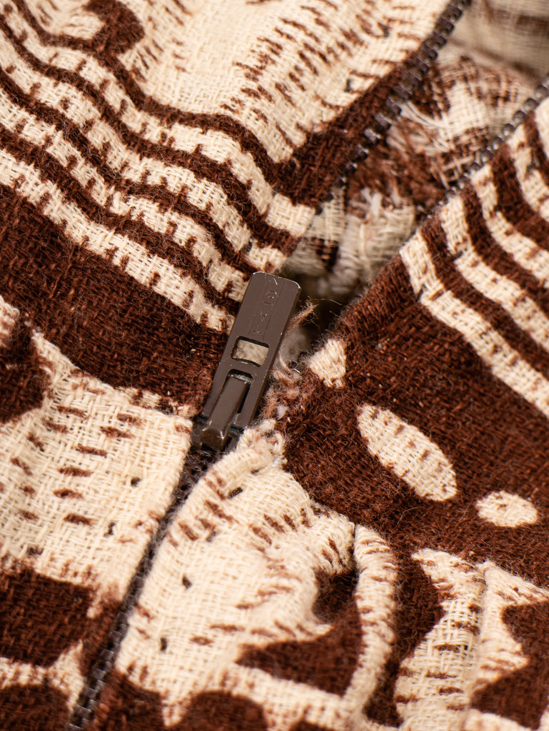 closeup of the zipper of a 1940's brown patterned sleeveless barkcloth midi dress