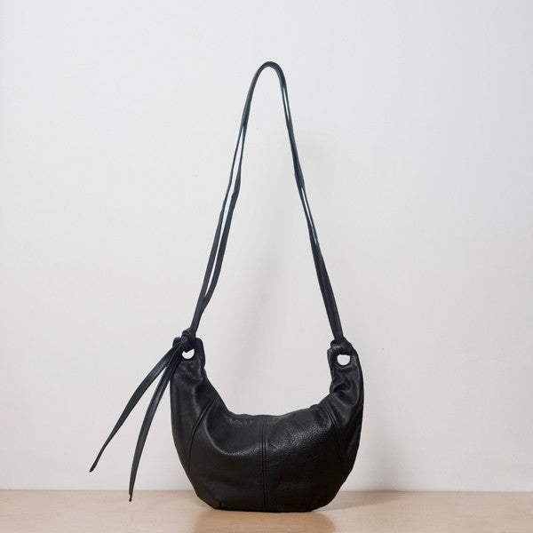 a large hobo leather purse in black leather with a zip closure, handmade by erin templeton in vancouver, canada
