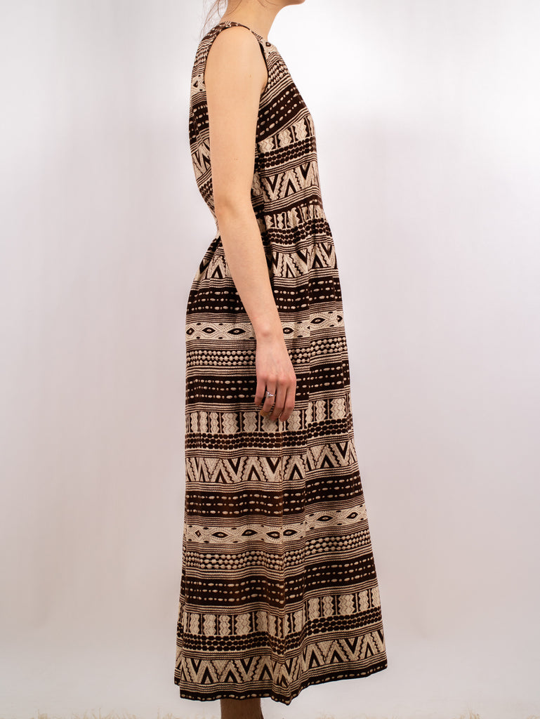 side view of 1940's brown patterned sleeveless barkcloth midi dress